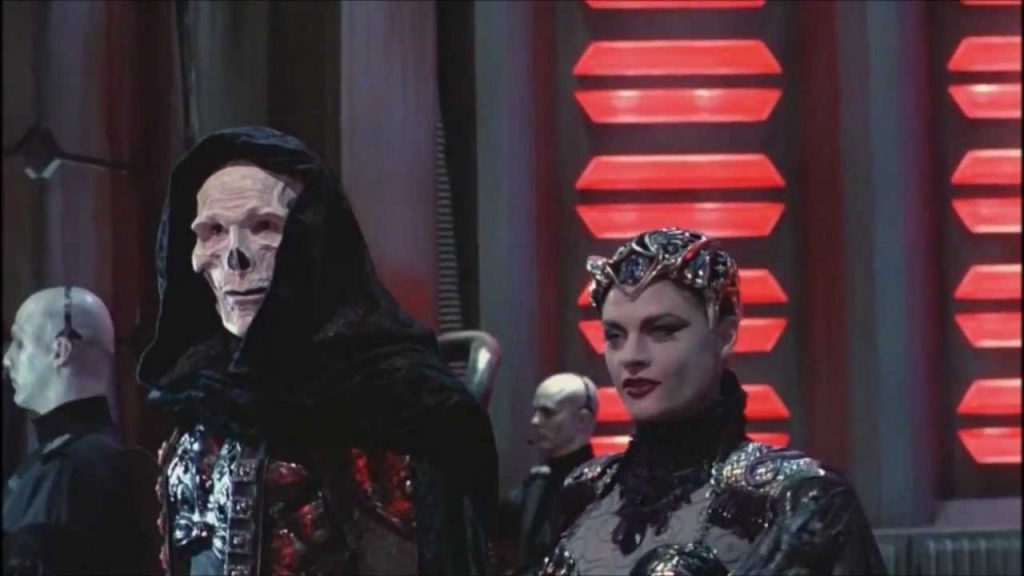 Evil Lyn (Meg Foster) is in his corner and they are both very evil... 